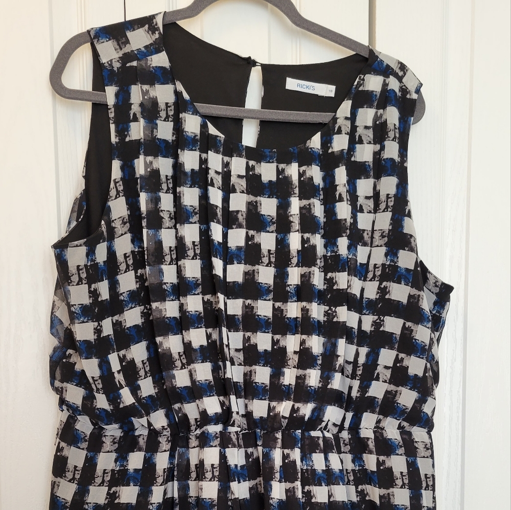 Black, green and blue plaid dress with floral details.